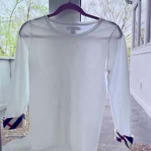 Burberry long sleeve tee for girls. Burberry plaid detail on sleeve cuffs.